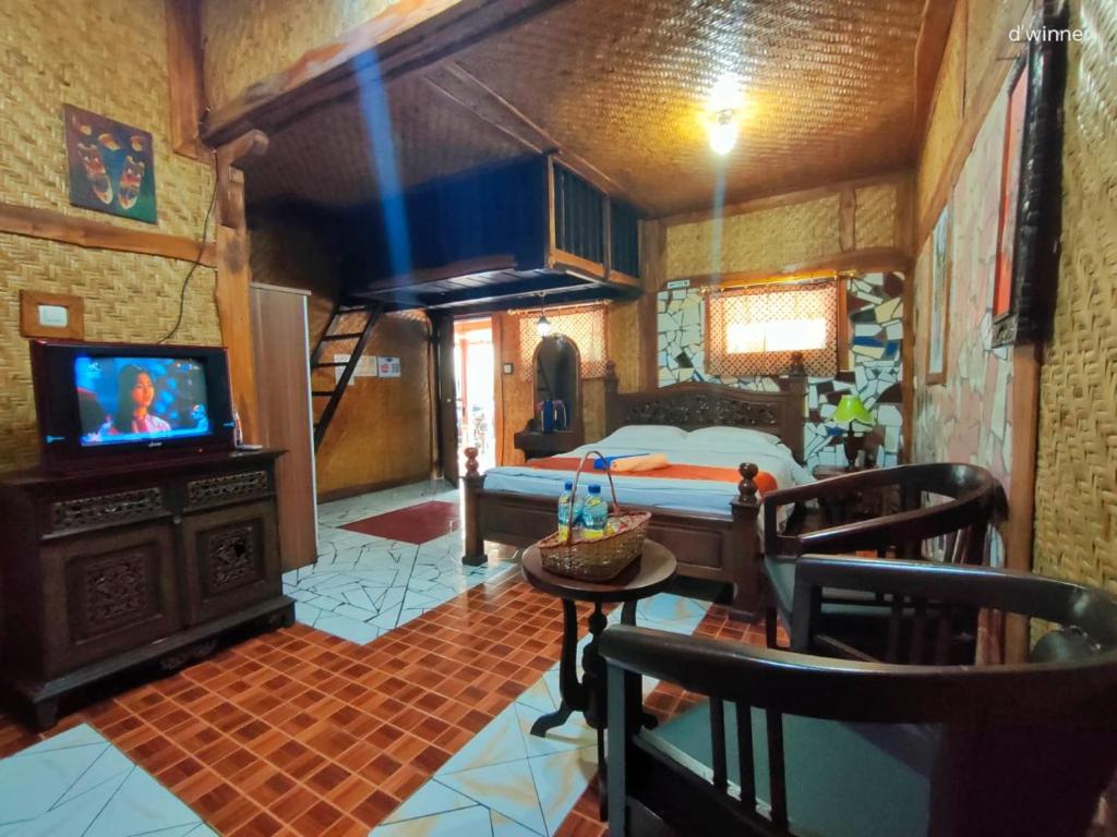 Postel nebo postele na pokoji v ubytování Yoschi's Hotel Bromo
