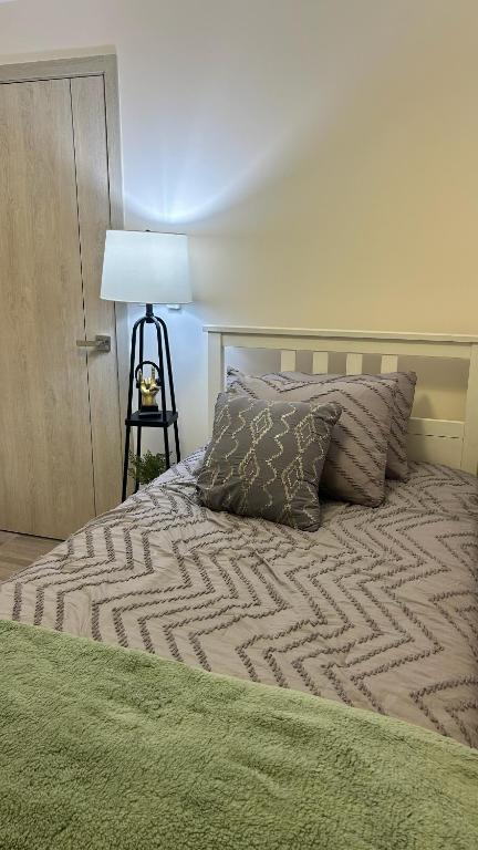 Postel nebo postele na pokoji v ubytování Distrito Artemisa Loft Apartments
