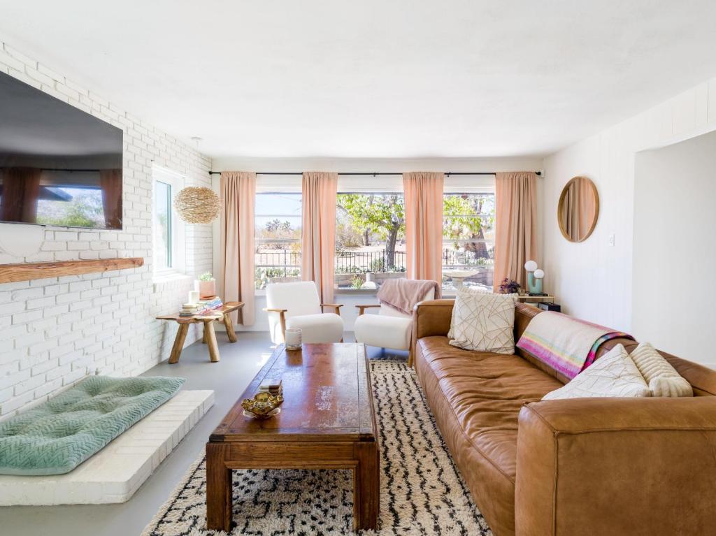 a living room with a couch and a table at KnowWhere Joshua Tree home in Joshua Tree