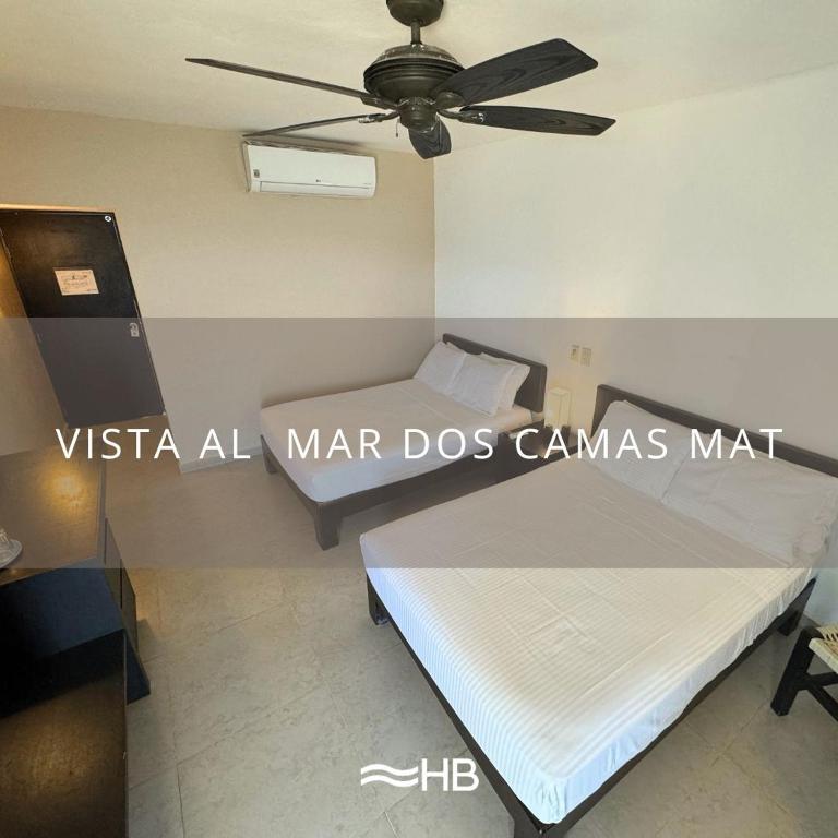 Postel nebo postele na pokoji v ubytování Hotel Barra de Navidad
