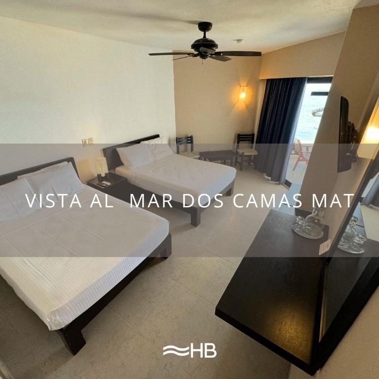 Postel nebo postele na pokoji v ubytování Hotel Barra de Navidad