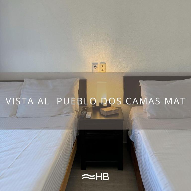 Postel nebo postele na pokoji v ubytování Hotel Barra de Navidad