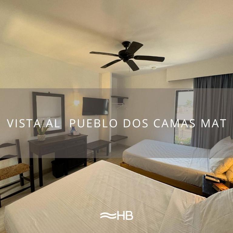 Postel nebo postele na pokoji v ubytování Hotel Barra de Navidad
