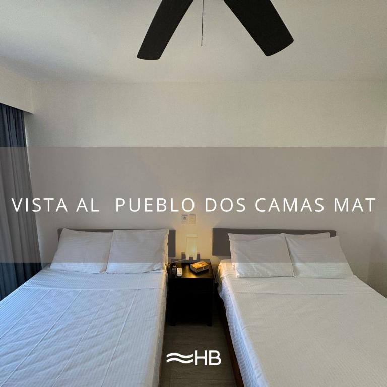 Postel nebo postele na pokoji v ubytování Hotel Barra de Navidad