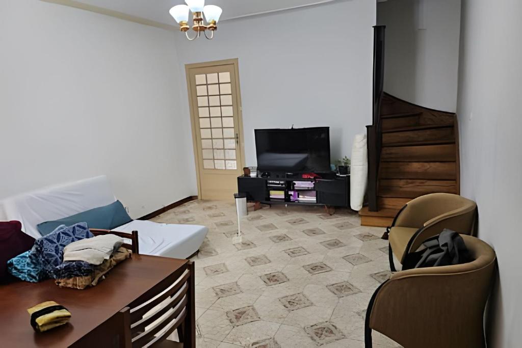 TV a/nebo společenská místnost v ubytování Casa Vergueiro