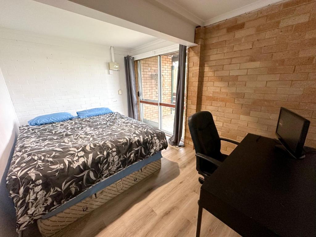 Letto o letti in una camera di Sunshine Rooms