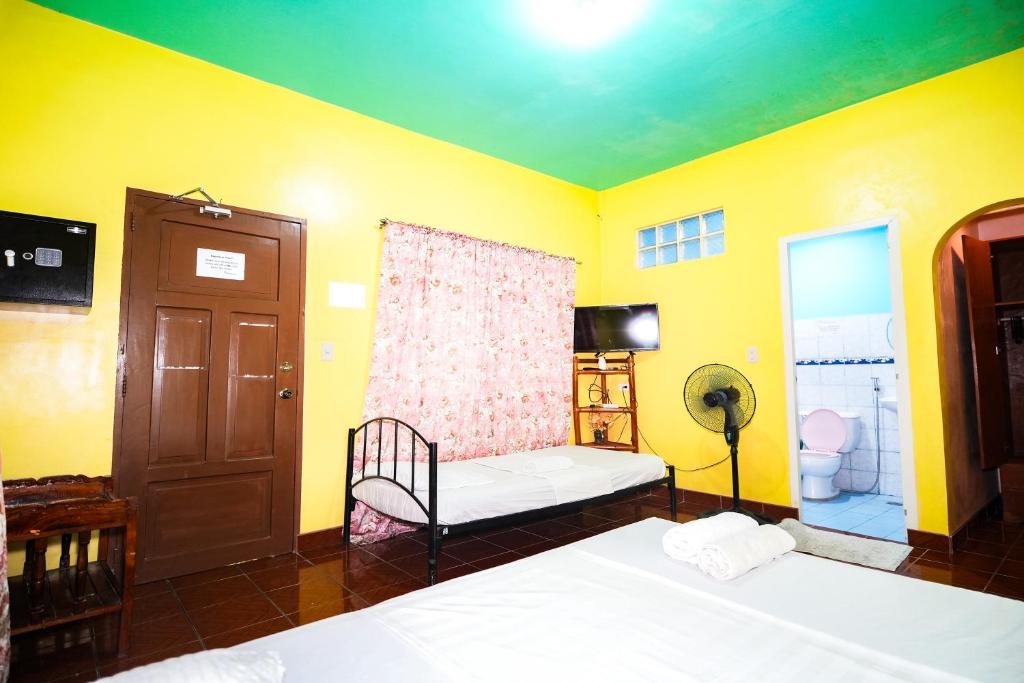 Postel nebo postele na pokoji v ubytování Gracias Inn Boracay
