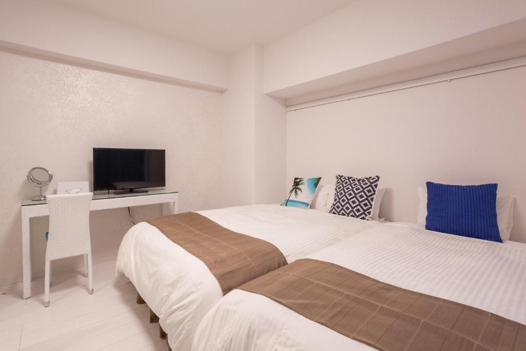 Living Inn Asahibashiekimae Anex 객실 침대