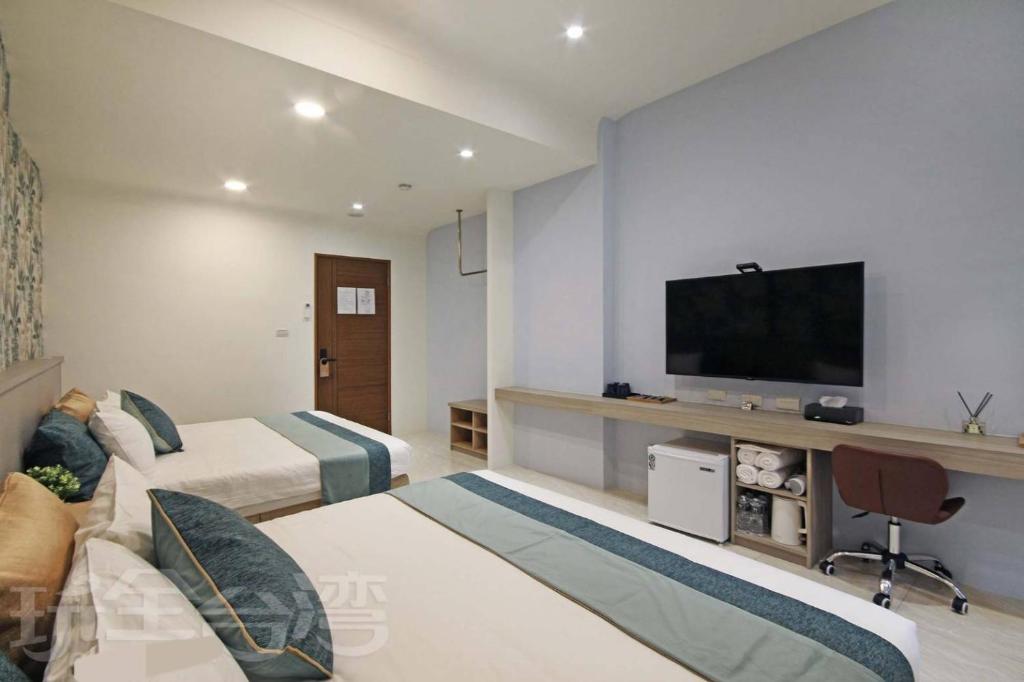 TV a/nebo společenská místnost v ubytování Station Sea B&B