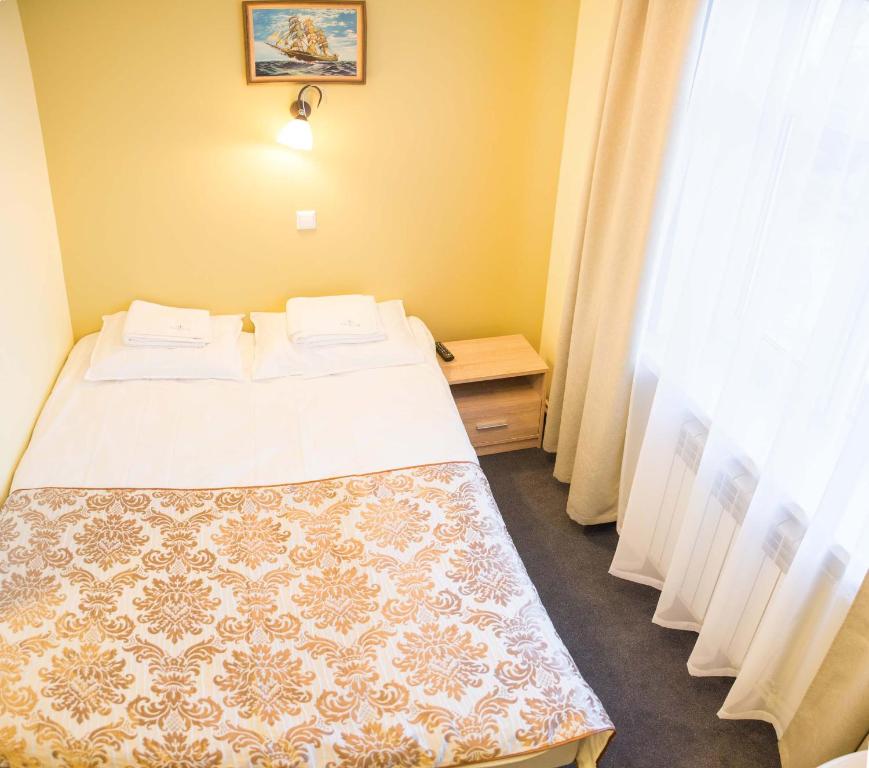 Postel nebo postele na pokoji v ubytování Ankur Hotell