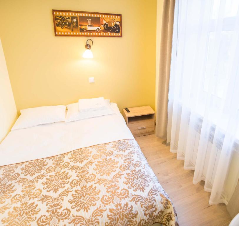 Postel nebo postele na pokoji v ubytování Ankur Hotell