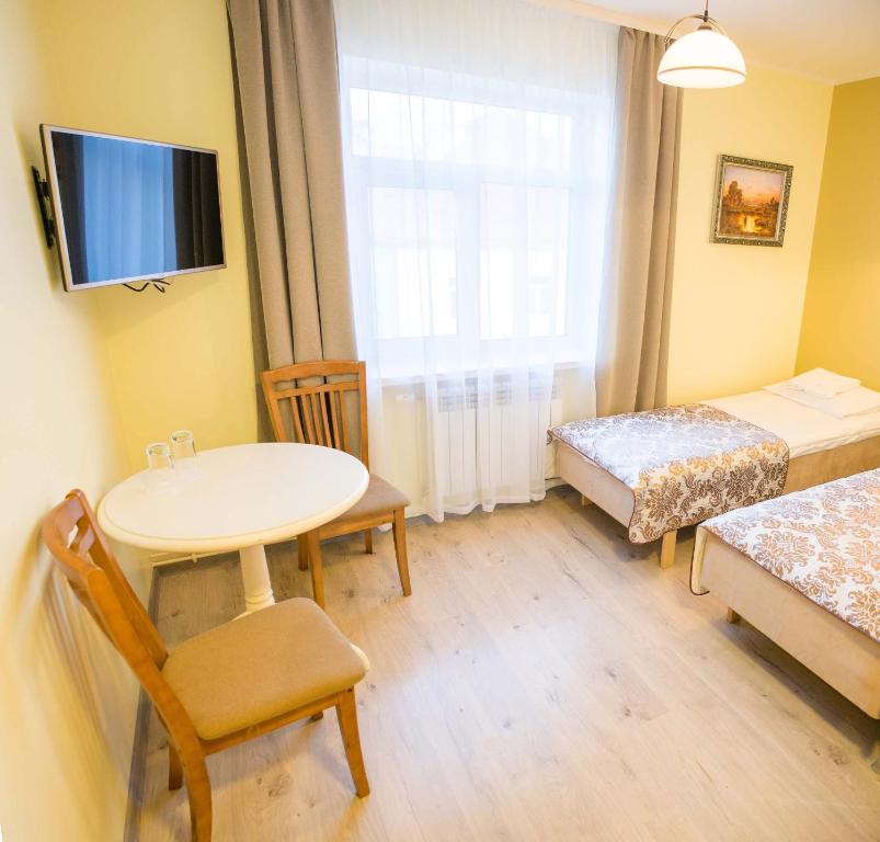 Postel nebo postele na pokoji v ubytování Ankur Hotell