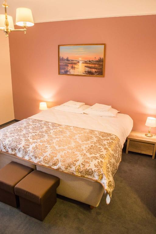 Postel nebo postele na pokoji v ubytování Ankur Hotell