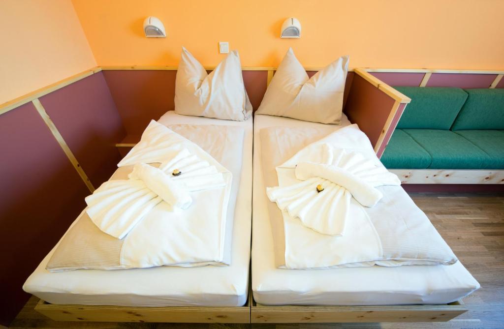 Postel nebo postele na pokoji v ubytování JUFA Hotel Planneralm
