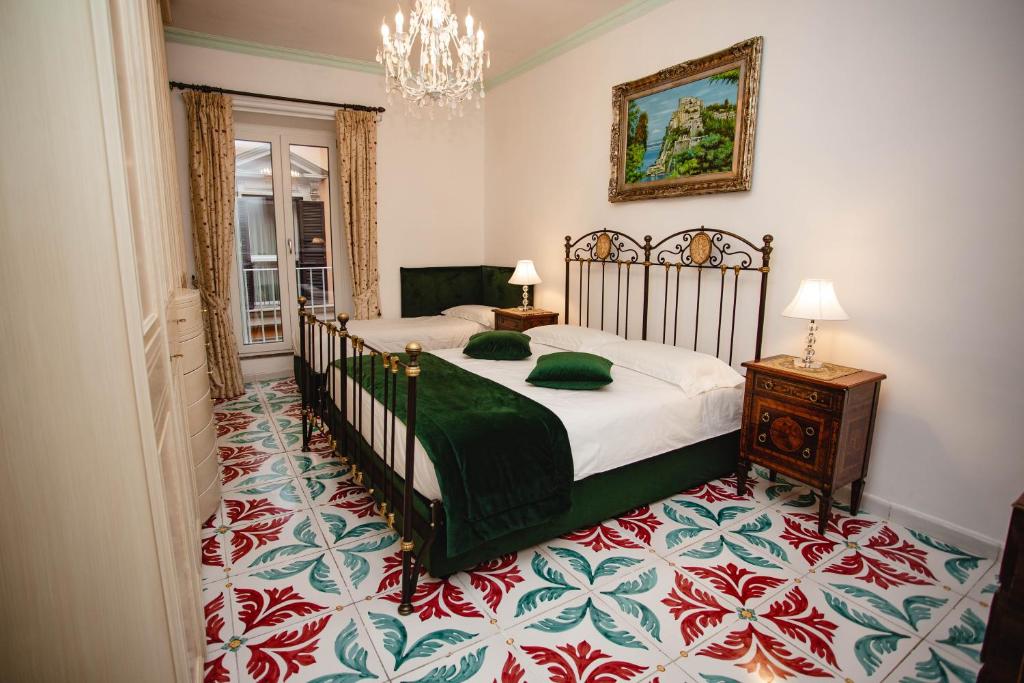 A bed or beds in a room at Delfini Trevi House