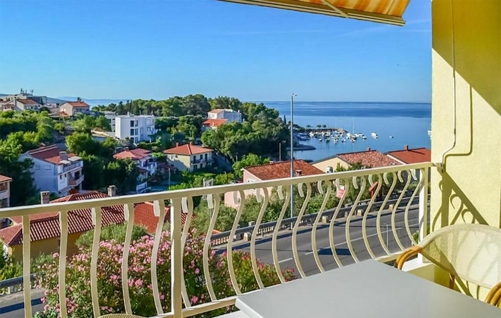 a balcony with a view of the water at Stunning Apartment In Krk With Wifi in Krk