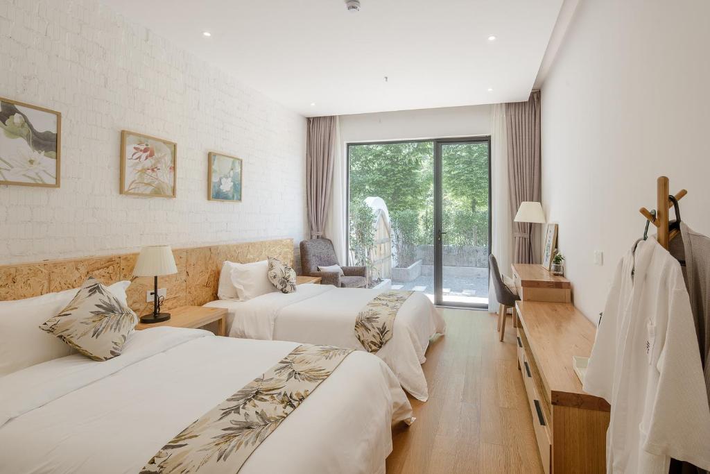 Postel nebo postele na pokoji v ubytování Vretreats yunxishang Boutique Hotel