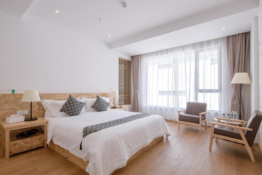 Postel nebo postele na pokoji v ubytování Vretreats yunxishang Boutique Hotel
