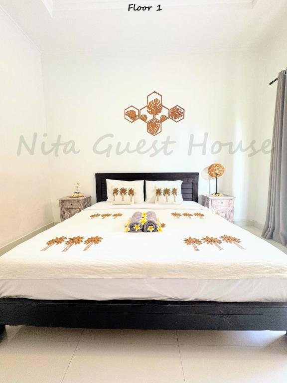 Postel nebo postele na pokoji v ubytování Nita Guest House Bali