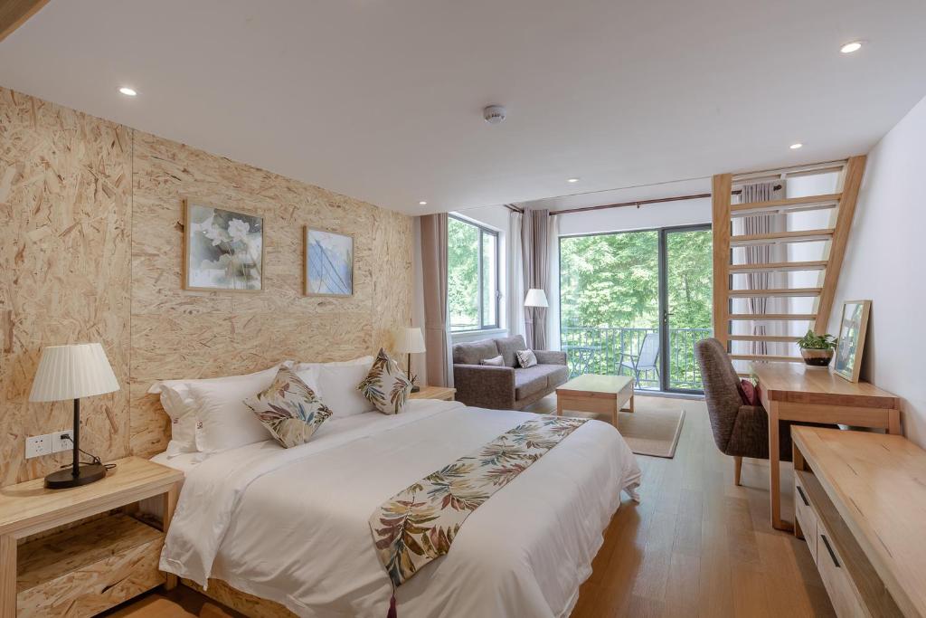 Postel nebo postele na pokoji v ubytování Vretreats yunxishang Boutique Hotel