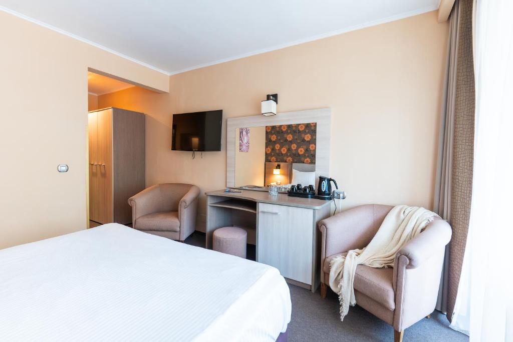 Postel nebo postele na pokoji v ubytování Hotel Sinaia