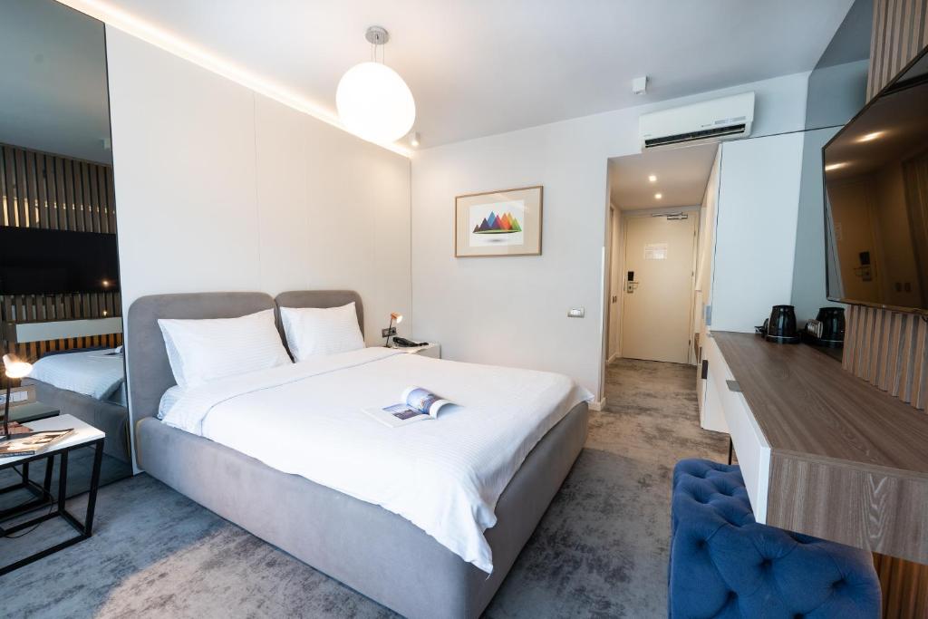 Postel nebo postele na pokoji v ubytování Hotel Sinaia