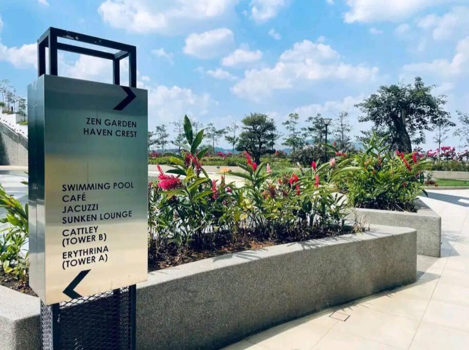a sign in front of a park with flowers at Green Haven Unique Relaxing Home & Netflix in Masai