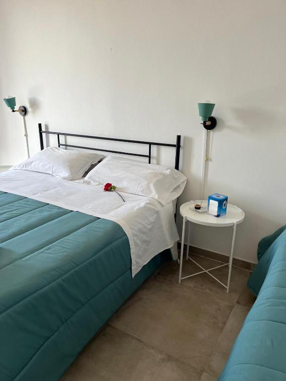 Postel nebo postele na pokoji v ubytování Falaride suite Agrigento discesa sulla valle di oro