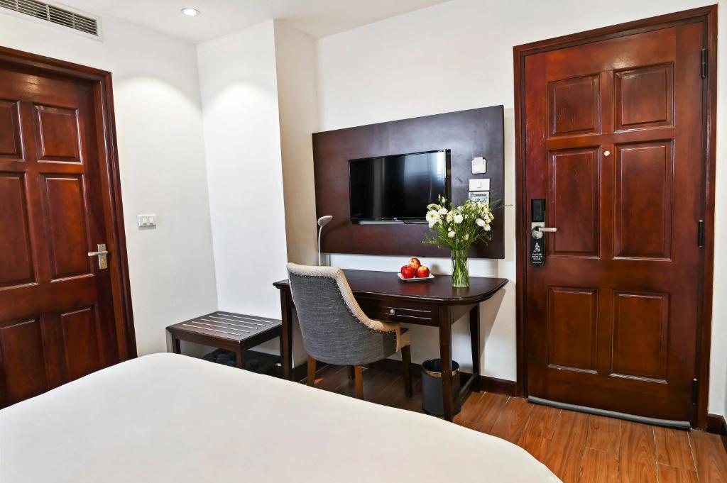 Postel nebo postele na pokoji v ubytování Bradi Gate- 22Land Residence Hotel