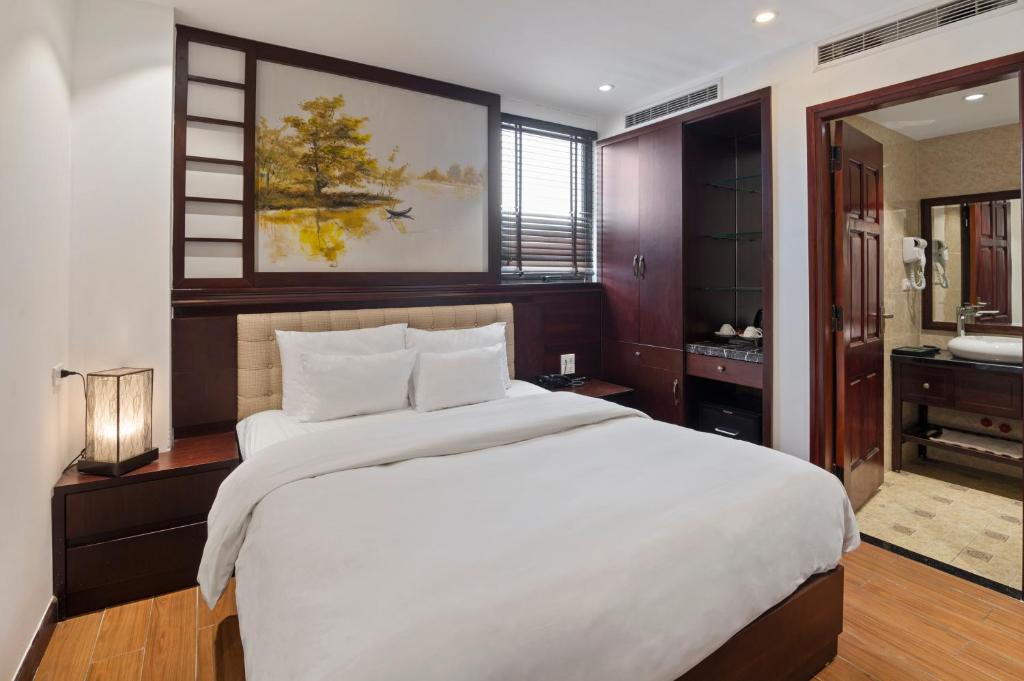Postel nebo postele na pokoji v ubytování Bradi Gate- 22Land Residence Hotel