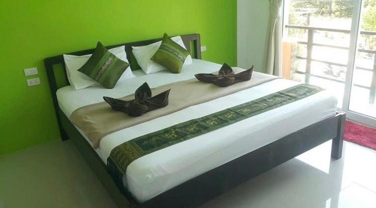 Postel nebo postele na pokoji v ubytování Phangan Guest House