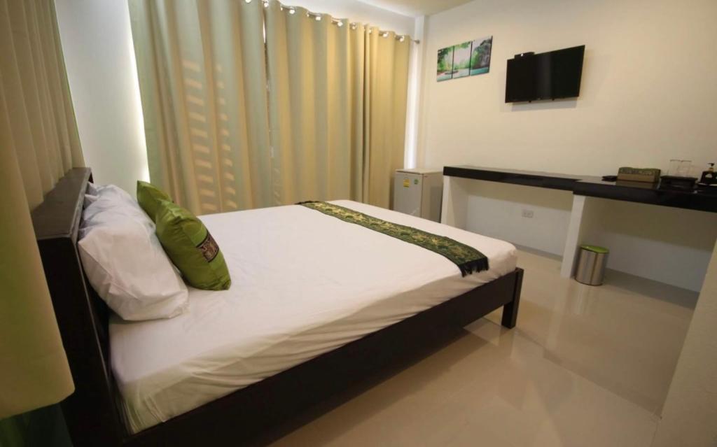 Postel nebo postele na pokoji v ubytování Phangan Guest House