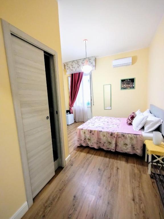 Łóżko lub łóżka w pokoju w obiekcie Al Quadrato D'Oro rooms