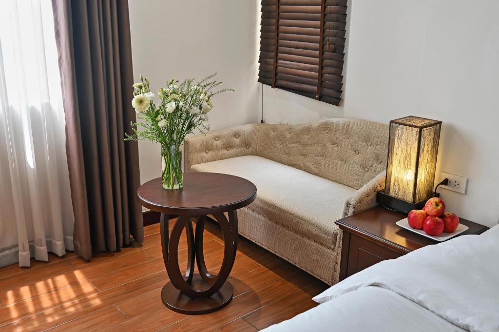 Postel nebo postele na pokoji v ubytování Bradi Gate- 22Land Residence Hotel