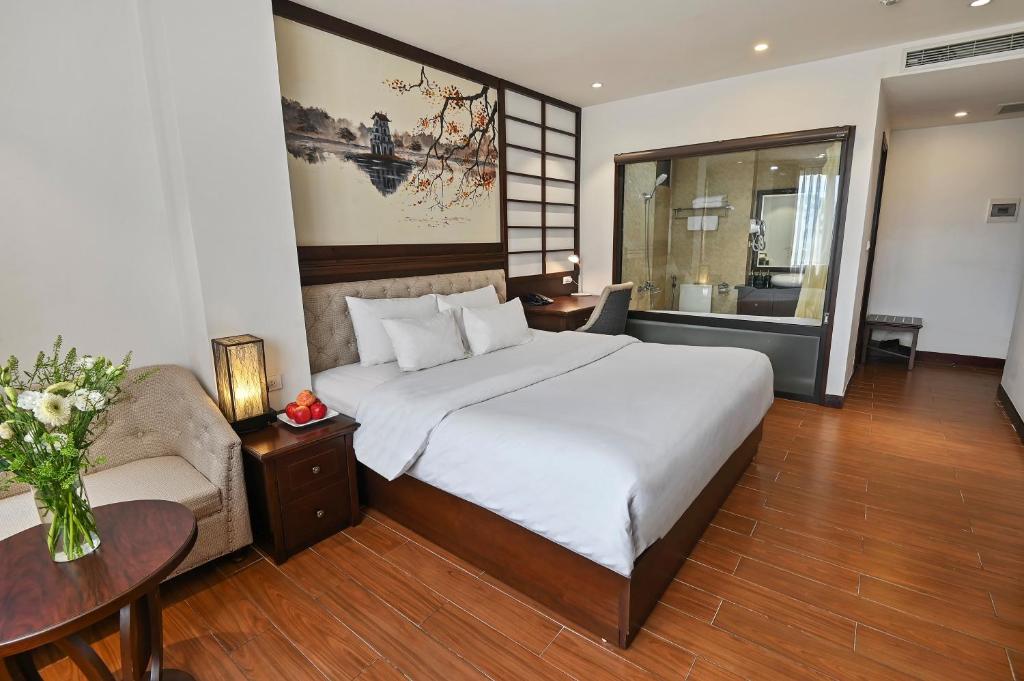 Postel nebo postele na pokoji v ubytování Bradi Gate- 22Land Residence Hotel