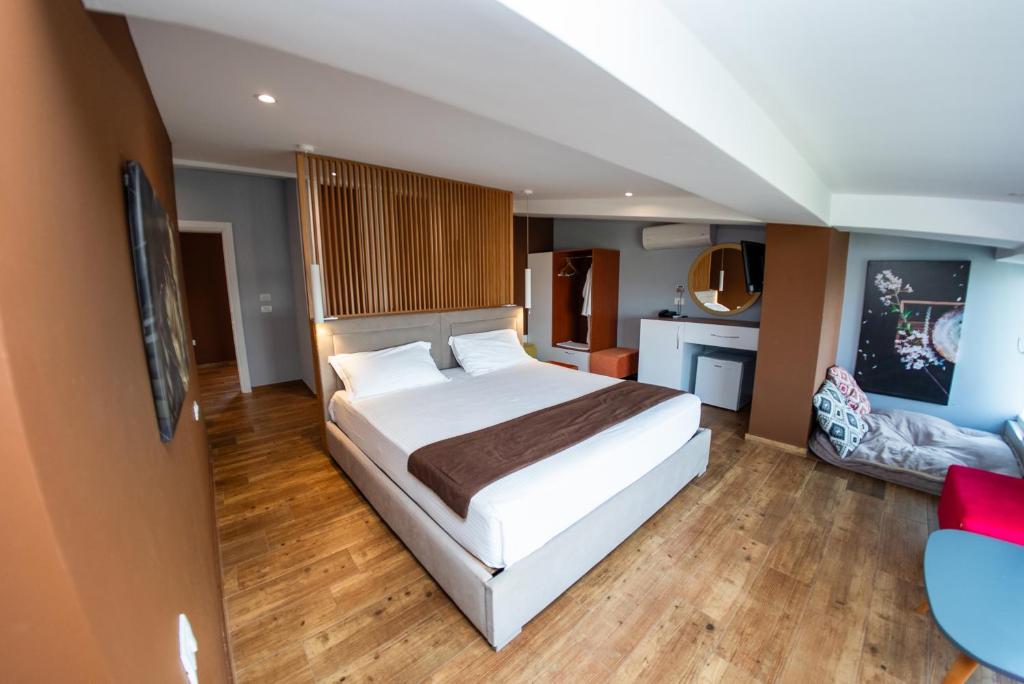 Postel nebo postele na pokoji v ubytování Olivar Hotel Tirana