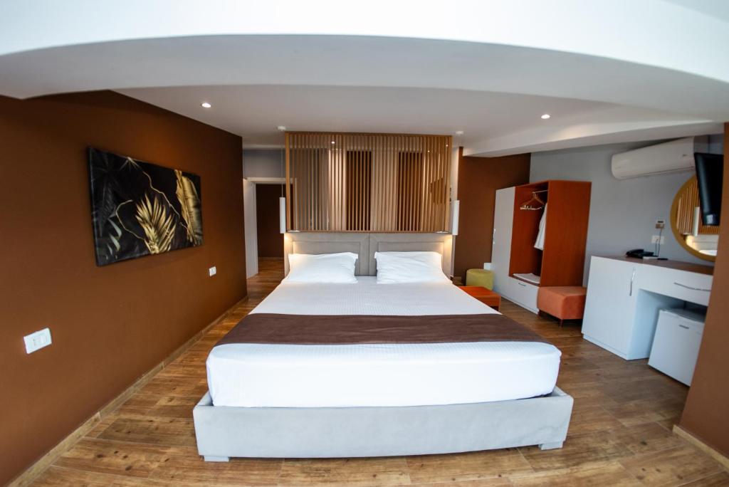 Postel nebo postele na pokoji v ubytování Olivar Hotel Tirana