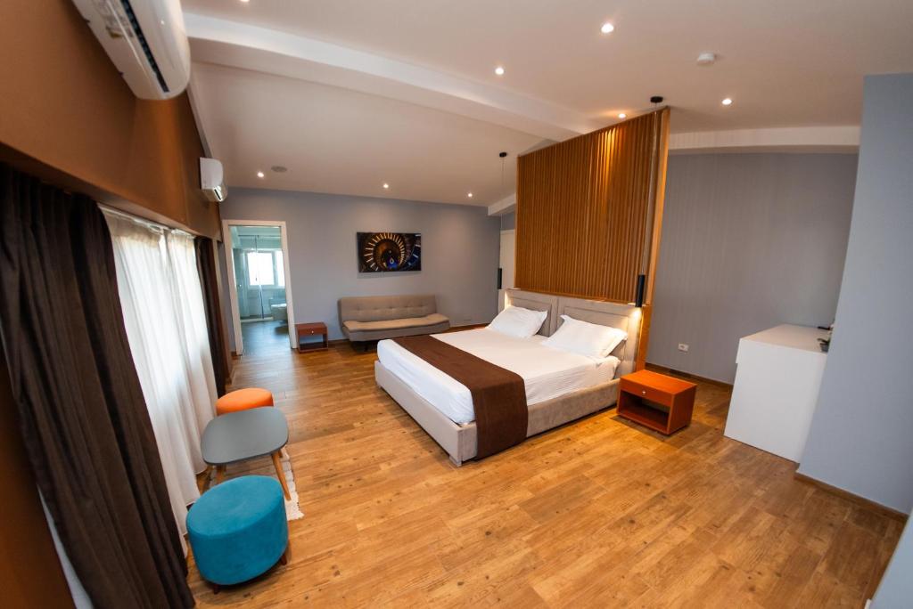 Postel nebo postele na pokoji v ubytování Olivar Hotel Tirana