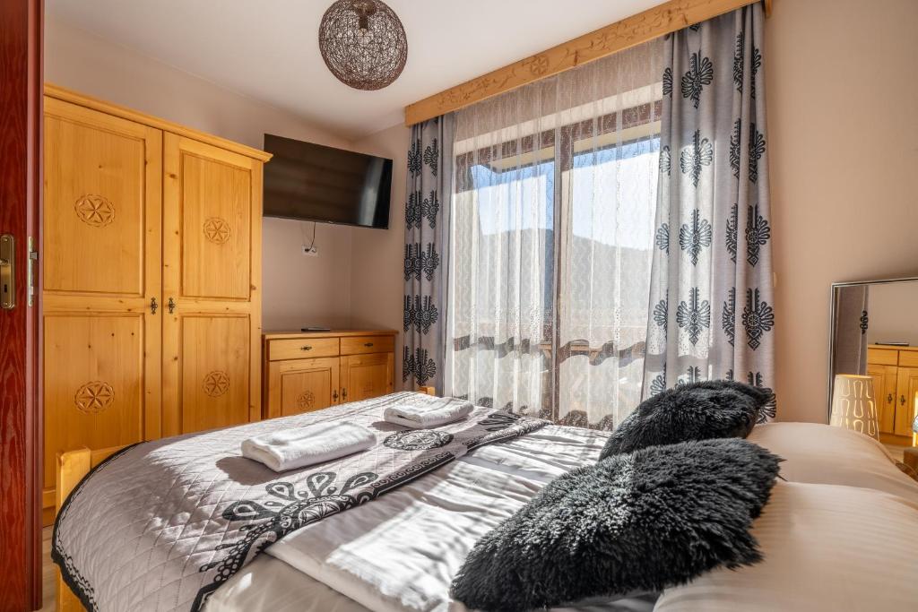 Postel nebo postele na pokoji v ubytování RentPlanet - Zakopane Kościelisko