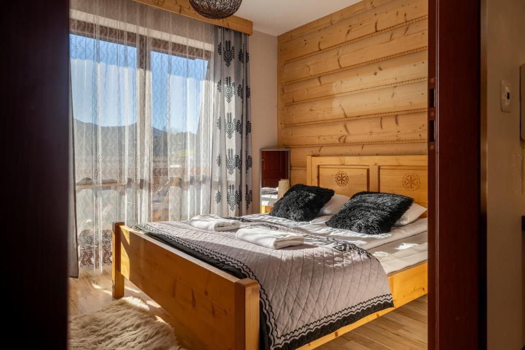 Postel nebo postele na pokoji v ubytování RentPlanet - Zakopane Kościelisko