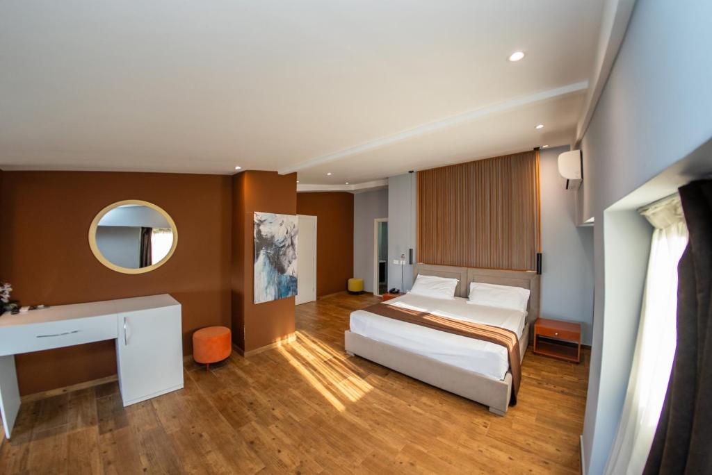 Postel nebo postele na pokoji v ubytování Olivar Hotel Tirana