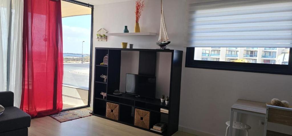 TV a/nebo společenská místnost v ubytování Apartamentos Tocororo