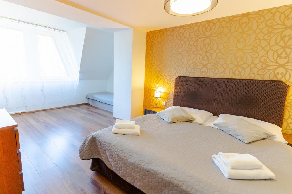 Postel nebo postele na pokoji v ubytování Hotel Ostredok