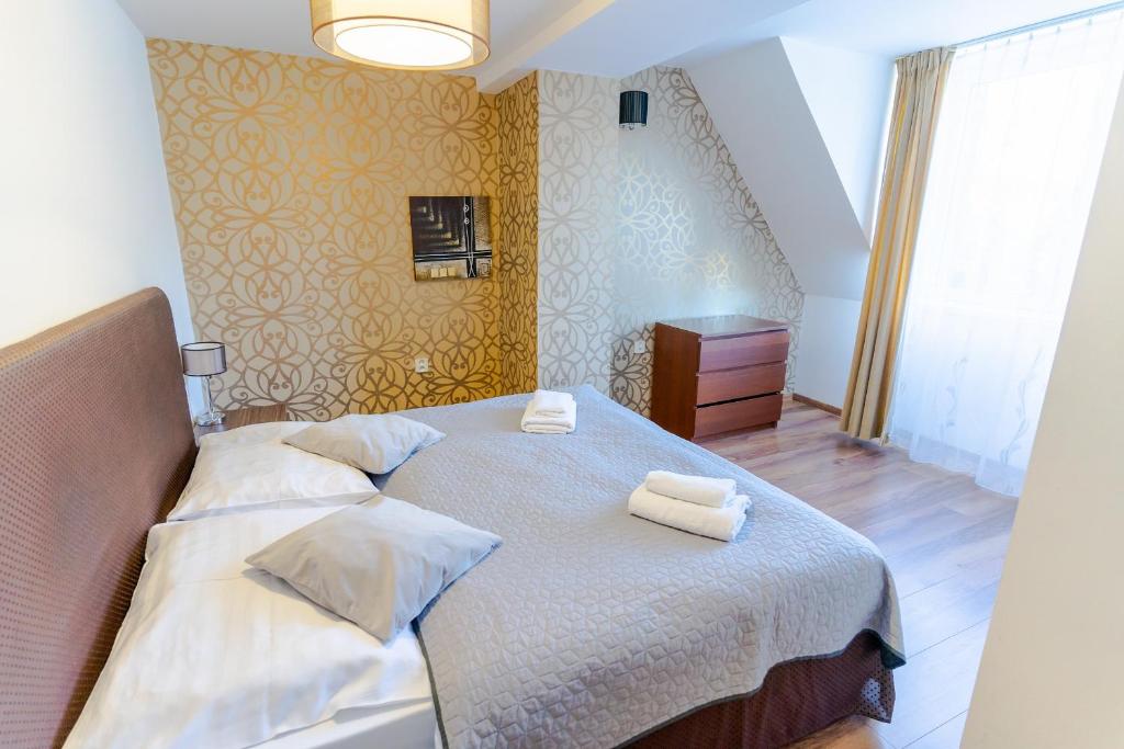 Postel nebo postele na pokoji v ubytování Hotel Ostredok