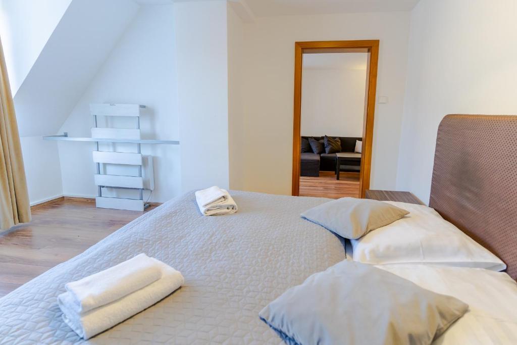 Postel nebo postele na pokoji v ubytování Hotel Ostredok