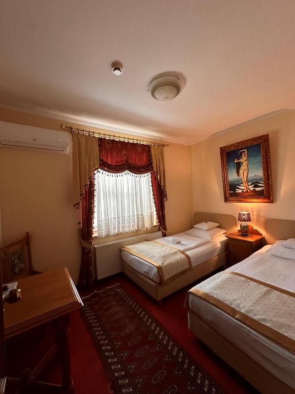 Postel nebo postele na pokoji v ubytování Hotel Grande
