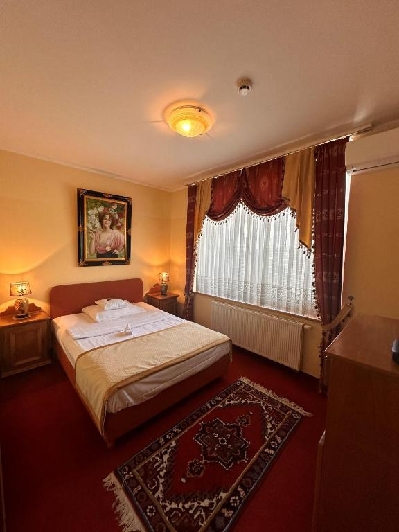 Postel nebo postele na pokoji v ubytování Hotel Grande