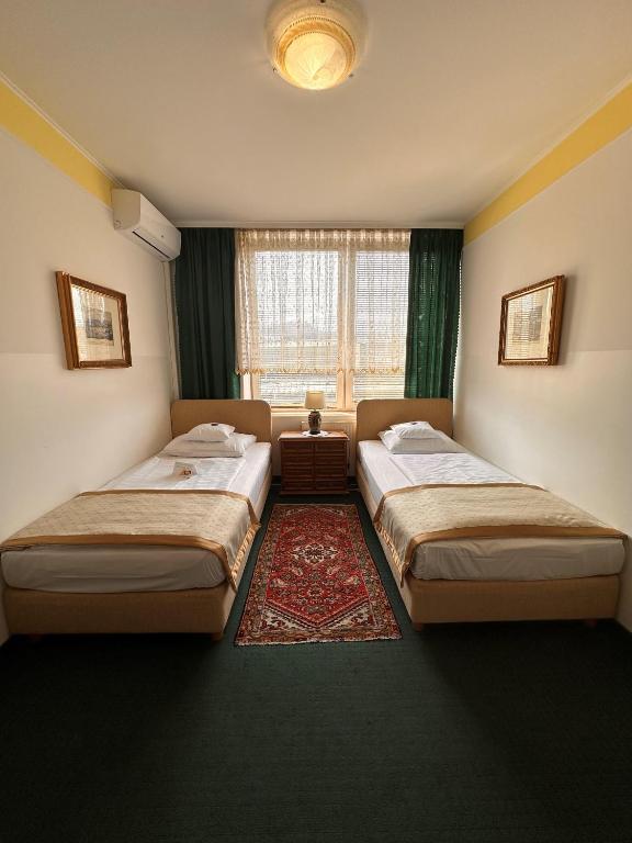 Postel nebo postele na pokoji v ubytování Hotel Grande