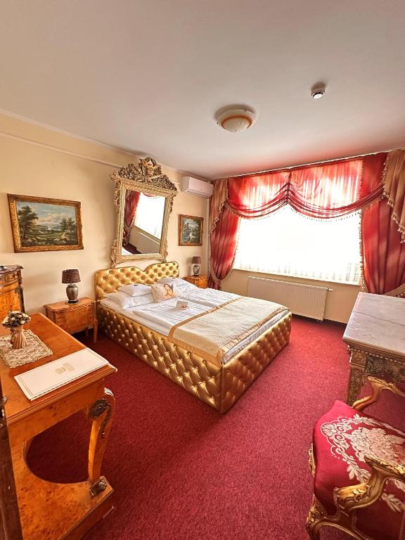 Postel nebo postele na pokoji v ubytování Hotel Grande