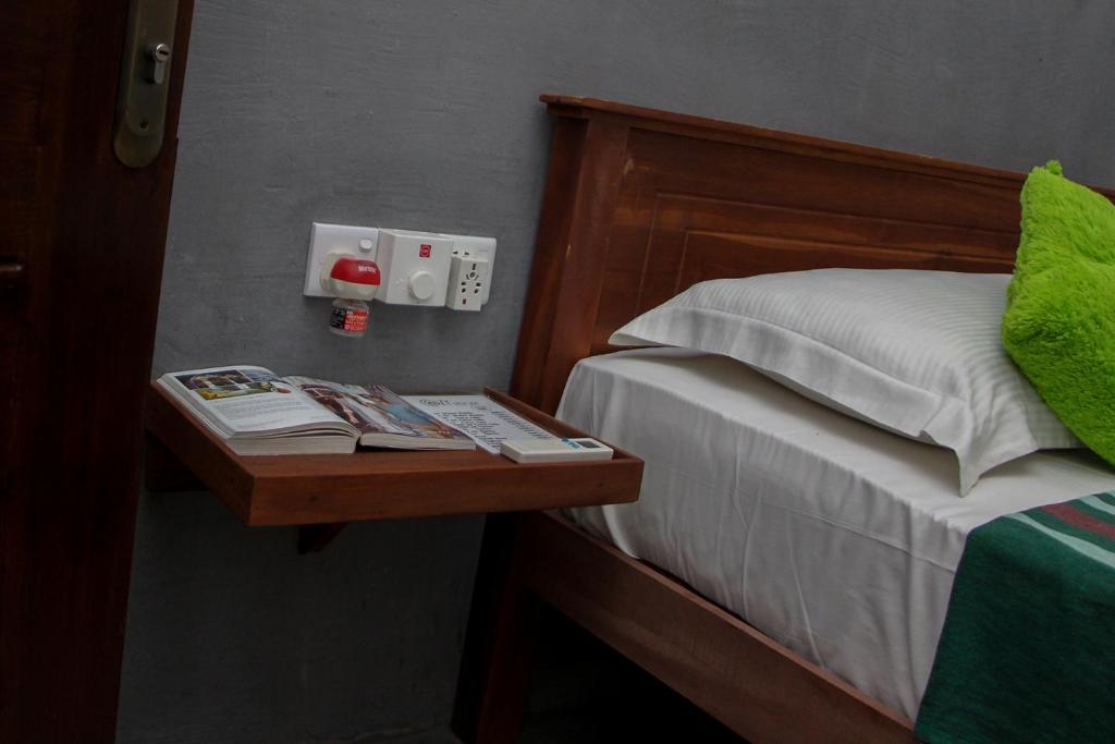 Postel nebo postele na pokoji v ubytování Cozy Resort